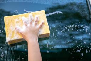 Girls use car wash sponge photo