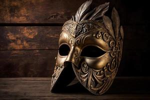 Golden venetian mask on a wooden table photo