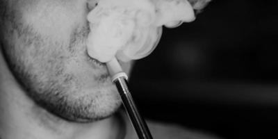 man smoking a hookah photo