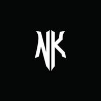 NK monogram letter logo ribbon with shield style isolated on black background vector