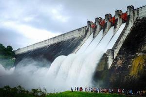 cement dam release water overflow in thailand photo