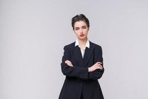 Attractive business young woman posing in business black suit with short photo
