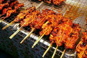 Grilled Chicken on the stove Street food in Thai style for sale.chicken BBQ photo