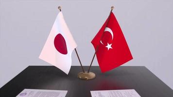 Japan and Turkey flags at politics meeting. Business deal video