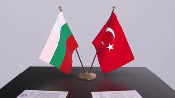 Bulgaria and Turkey flags at politics meeting. Business deal video