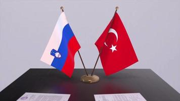 Slovenia and Turkey flags at politics meeting. Business deal video