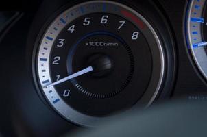 detail with the gauges on the dashboard of a car photo