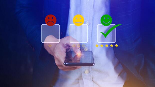 Customer service evaluation concept feedback rating and positive customer review experience, using a smartphone And pressing face emoticon smile in satisfaction on virtual touch screen photo