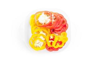 Fresh  bell pepper Yellow and red sliced on white background photo