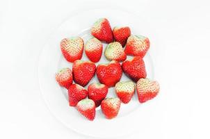 Top view Fruit, Fresh strawberry, berry red in white dish on white background photo