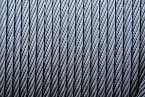 Coiled industrial cabling.Background of galvanized metal cable on the winch,Industrial wire roll background photo