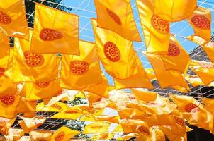 Thammachak flag yellow in temple Wat Phan tao on blue sky temple Northern Thailand photo