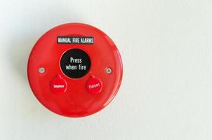 fire alarm press box  on wall background photo