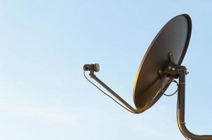 Satellite dish on the roof and clear sky background in the morning photo