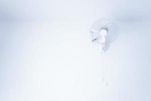 Wall mount electric white fan,electric fan hanging on white mortar wall photo