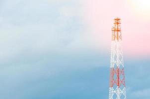 telecom,communication antennas, radio telephone mobile phone antennas on blue sky photo