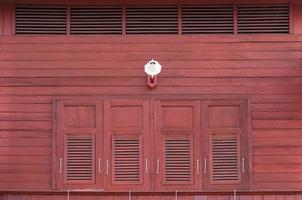 Vintage windows with  wooden shutters on the exterior and antique lamps photo