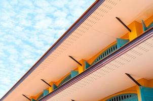 Vintage eaves brick wall in blue sky background ,Minimal old geometrical building architecture photo