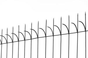 Old fashioned spike fence on white background,Steel sharp fence photo