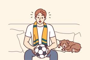 Young man sit on couch watching football game at home. Male sport fan with ball in hands enjoy match indoors. Vector illustration.