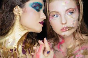 Two young women with creative make-up photo