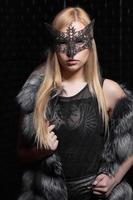 Young pretty blonde in a mask photo