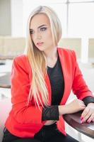 Charming young woman posing in a cafe photo