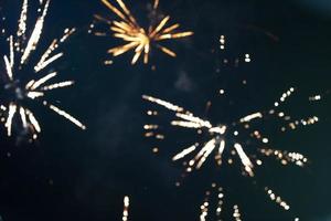 On a black background bokeh from explosions of colorful fireworks. photo