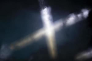 A cross made of smoke on a dark background. Stripes of smoke. photo