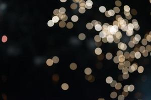 On a black background bokeh from explosions of colorful fireworks. photo