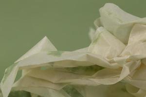 Background from crumpled paper with a green tint. photo