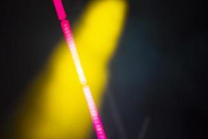 Yellow blurry smoke spot and pink bokeh streak. photo