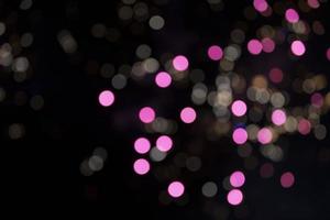 On a black background bokeh from explosions of colorful fireworks. photo