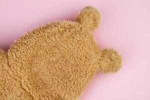 Funny bear made of fur on a pink background. Abstract bear. photo