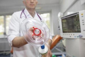 Oxygen mask as part of a ventilator in the operating room, close-up. photo