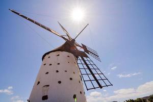 Old white windmill photo