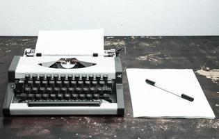 Typewriter on desk photo