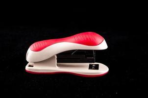 Red stapler isolated photo