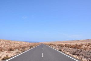 Road through the scenic landscape photo