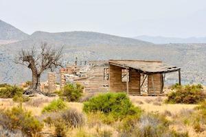 Abandoned building in the desert photo