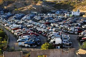 Abandoned cars in the junkyard photo