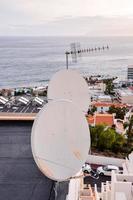 Satellite dishes on the rooftop photo