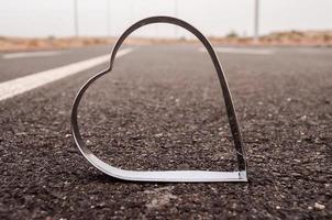Metal heart on the road photo