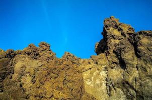 Rock formation under blue sky photo