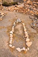 Grave marked with stones photo