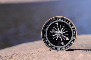 Compass on a rock photo