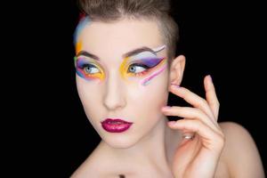 Young charming brunette with creative make up photo