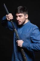 Alluring young man posing in studio photo