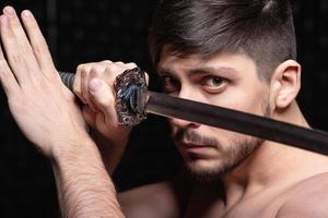 Portrait of handsome guy posing in studio photo