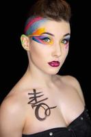 Young beautiful woman with creative make up photo